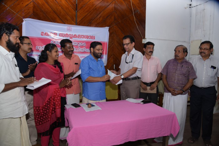 Handing over of the amount collected towards the contribution of CMDRF (from Teaching Departments and Affiliated colleges from Thiruvananthapuram) by the Vice-Chancellor to Shri. Kadakampally Surendran,Hon'ble Minister of Devasom, Tourism and Co-operation